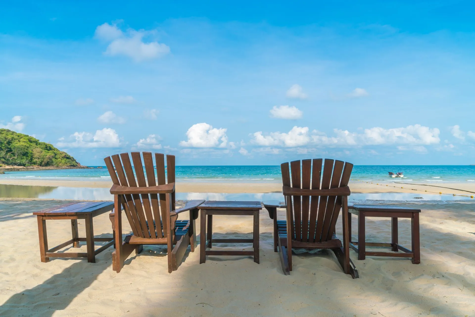 Beach chairs on white sand